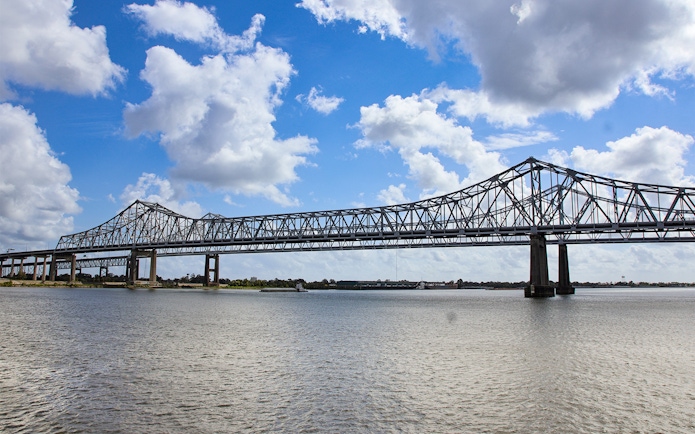 New Orleans bridge spanning Mississippi River viewed from Steamboat Natchez.