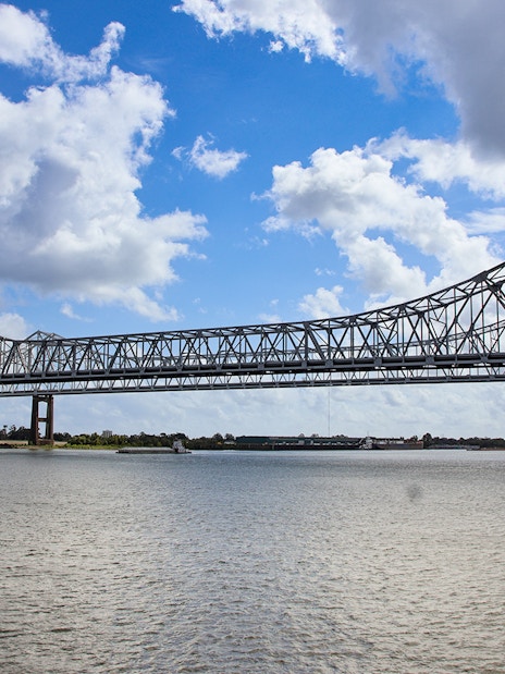 New Orleans bridge spanning Mississippi River viewed from Steamboat Natchez.