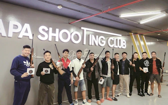 Group at Sa Pa Shooting Club holding rifles and targets, guided shooting experience.
