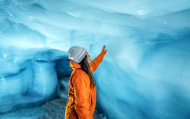 Guests exploring inside Ice Tunnel in Langjökull glacier, Iceland.