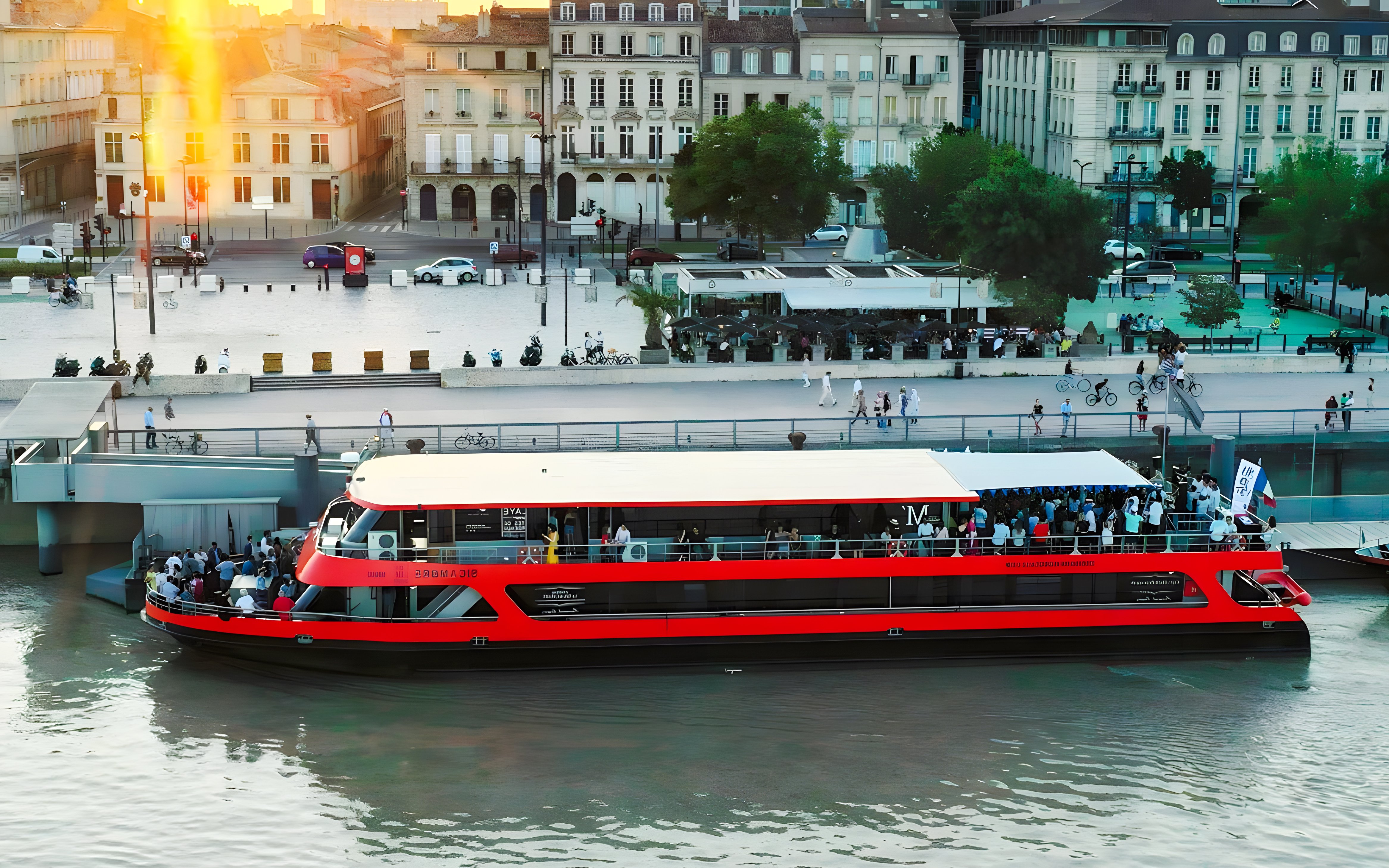 Bateaux Bordelais dinner cruise boat docked by the river in Bordeaux, France.