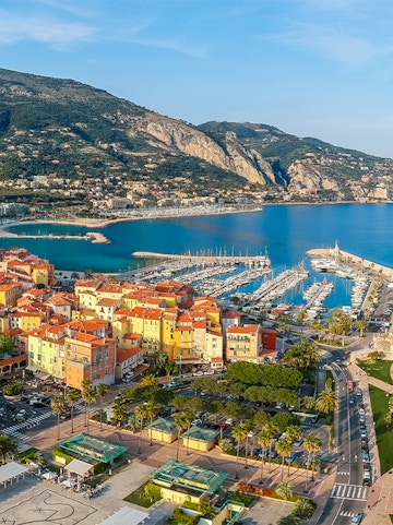 Aerial view of colorful buildings and marina in Menton, French Riviera.