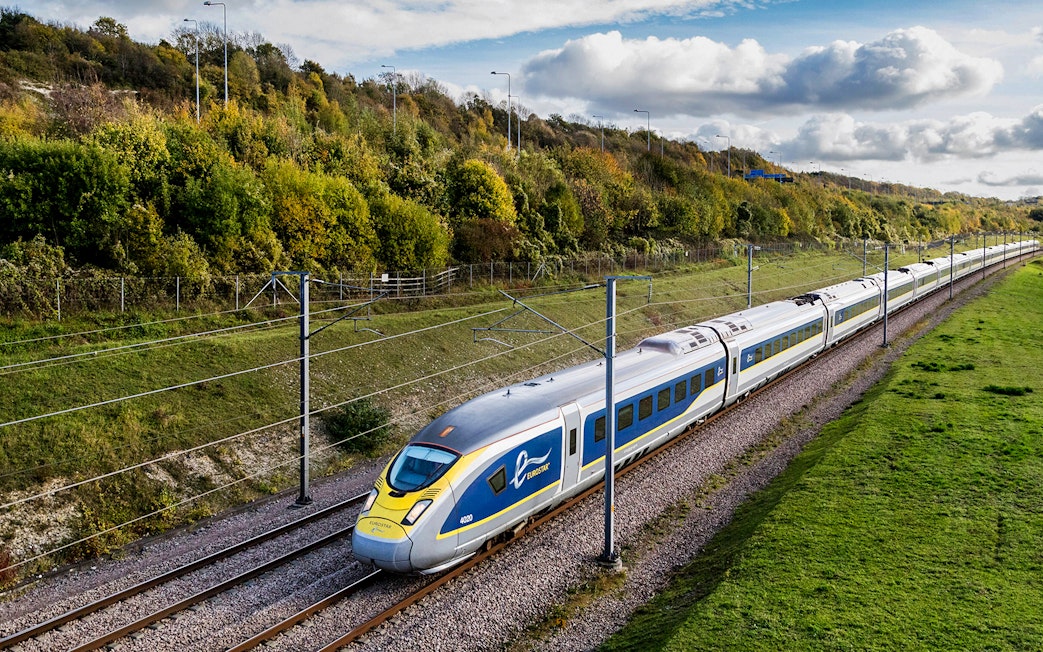 Eurostar train traveling through countryside, Eurail Pass experience.