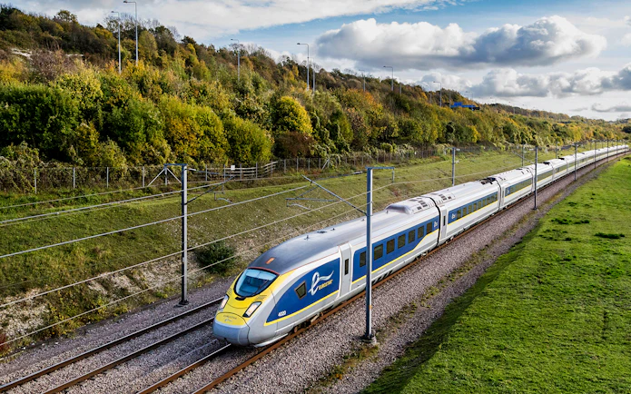 Eurostar train traveling through countryside, Eurail Pass experience.