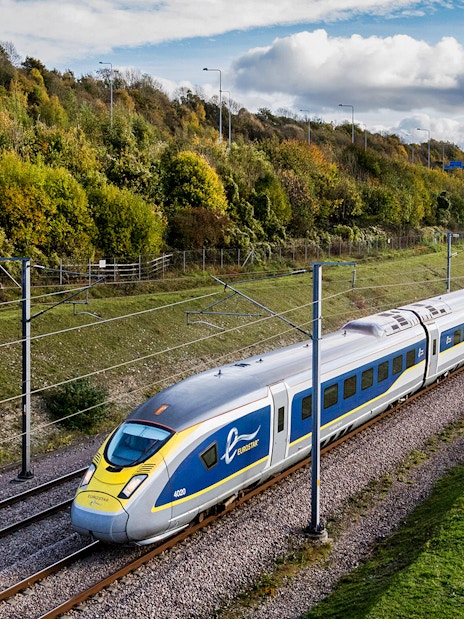 Eurostar train traveling through countryside, Eurail Pass experience.