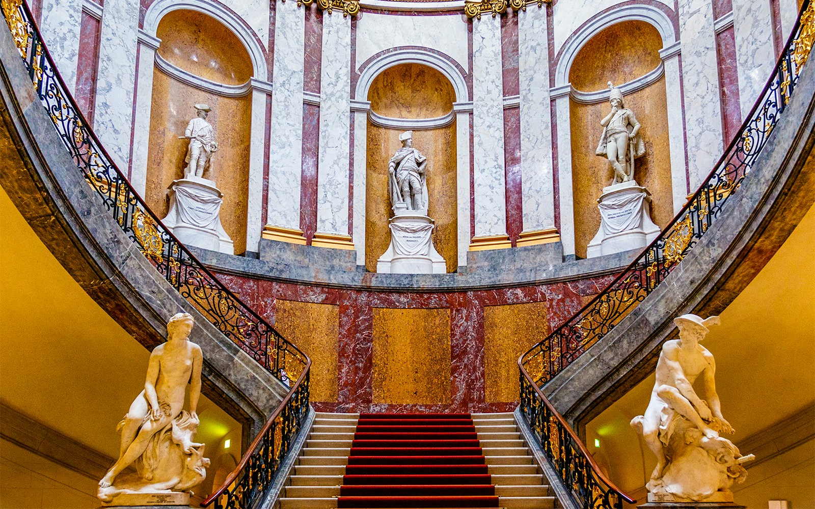 Bode Museum interior featuring grand staircase and ornate walls in Berlin, Germany.