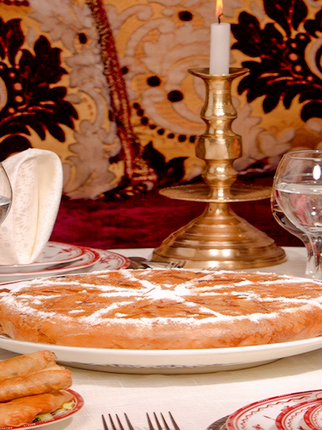 Traditional Moroccan dishes at Dar Essalam Dinner Show with ornate decor.