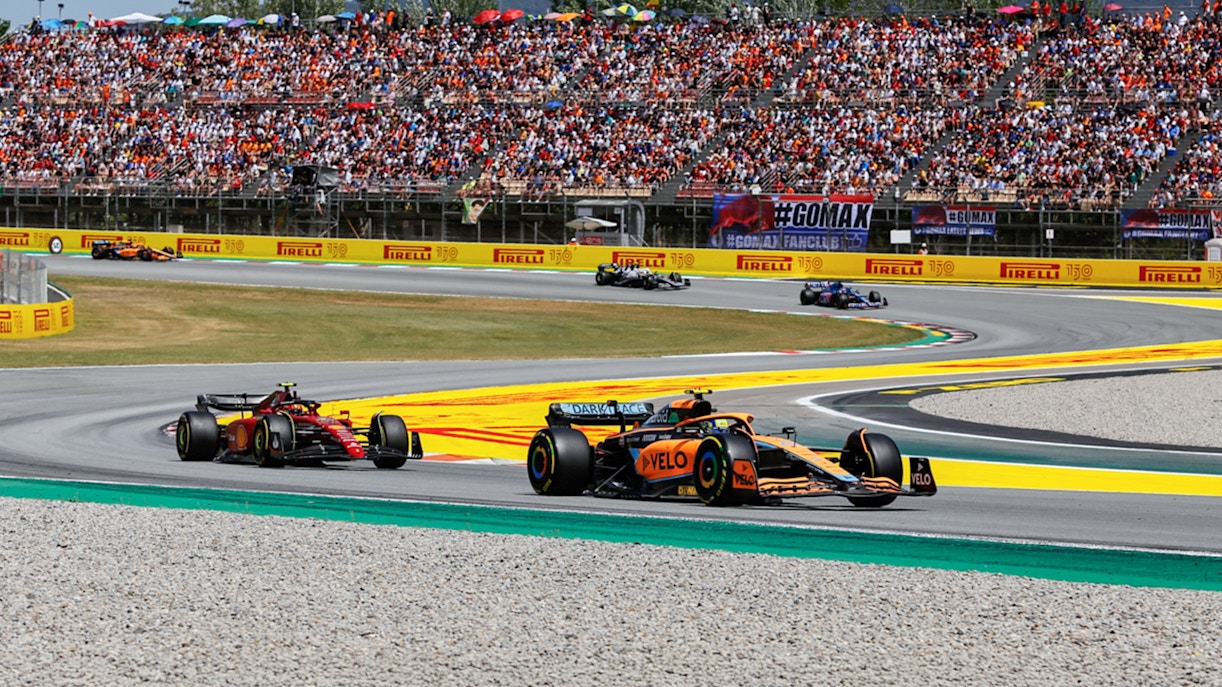 Formula 1 cars racing on the Circuit de Barcelona-Catalunya track in Spain.