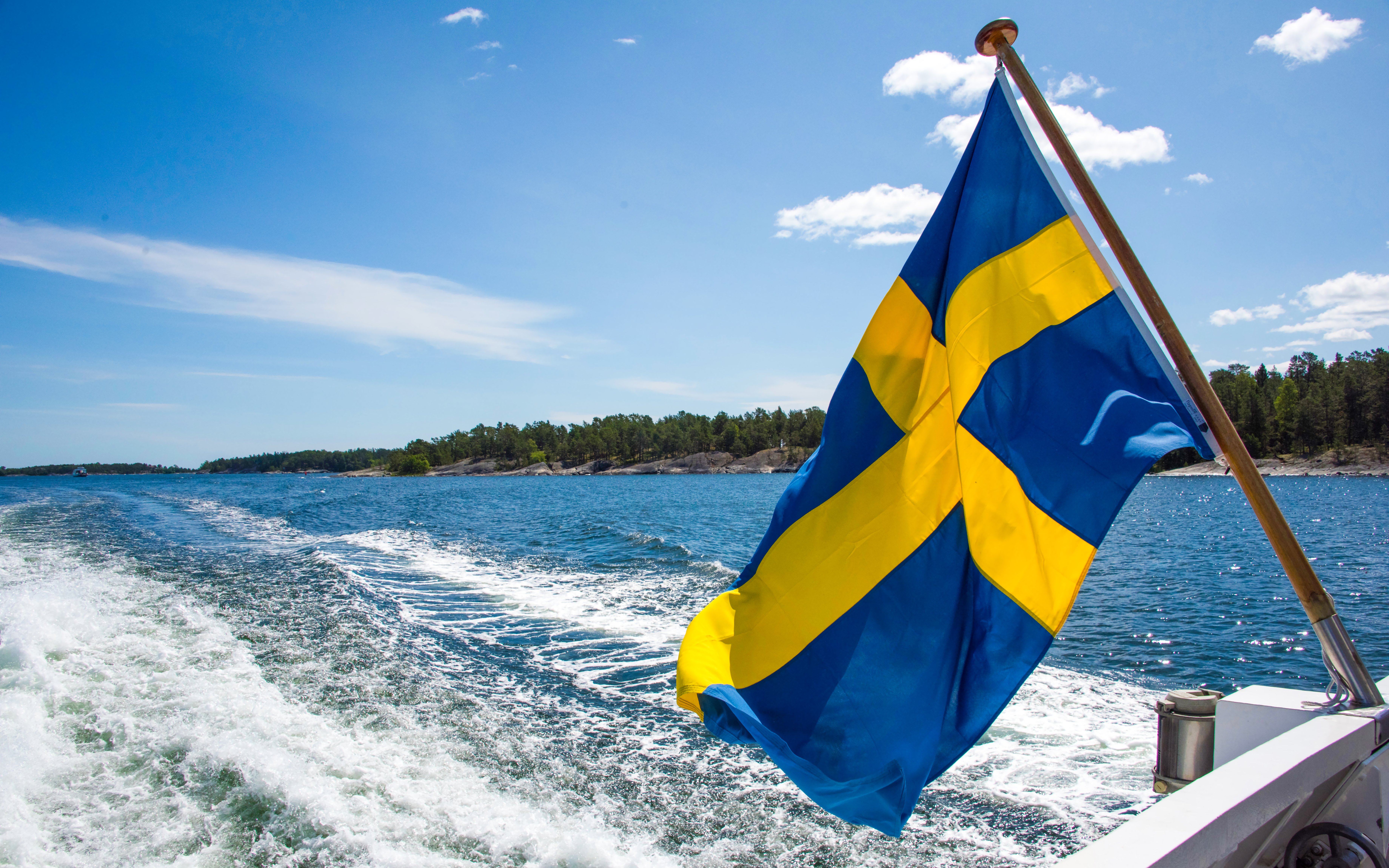 Swedish flag on a boat tour through Stockholm's archipelago islands.