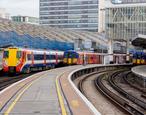 London Station train platform with passengers boarding.