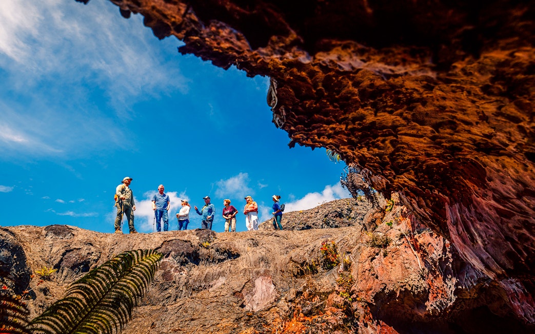 Guests exploring volcanic terrain on adventure tour in Hawaii.