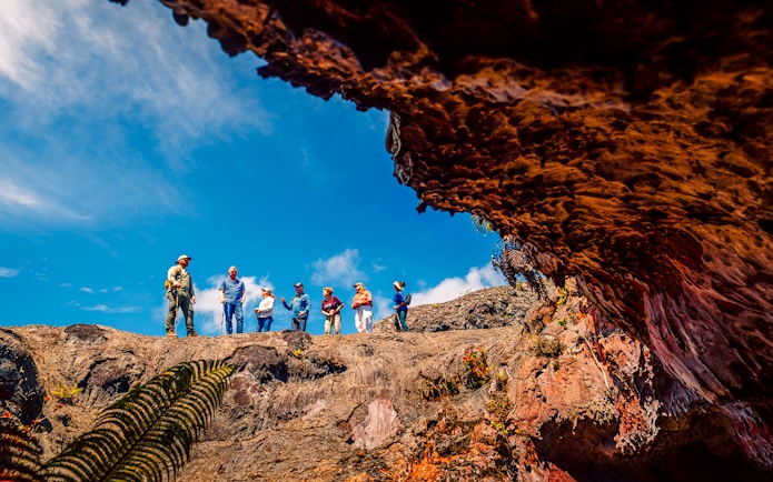 Guests exploring volcanic terrain on adventure tour in Hawaii.