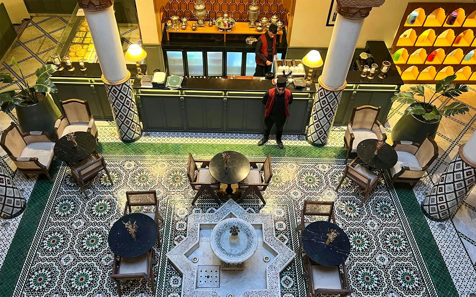 Moroccan Culinary Arts Museum interior with mosaic tiles and traditional seating.