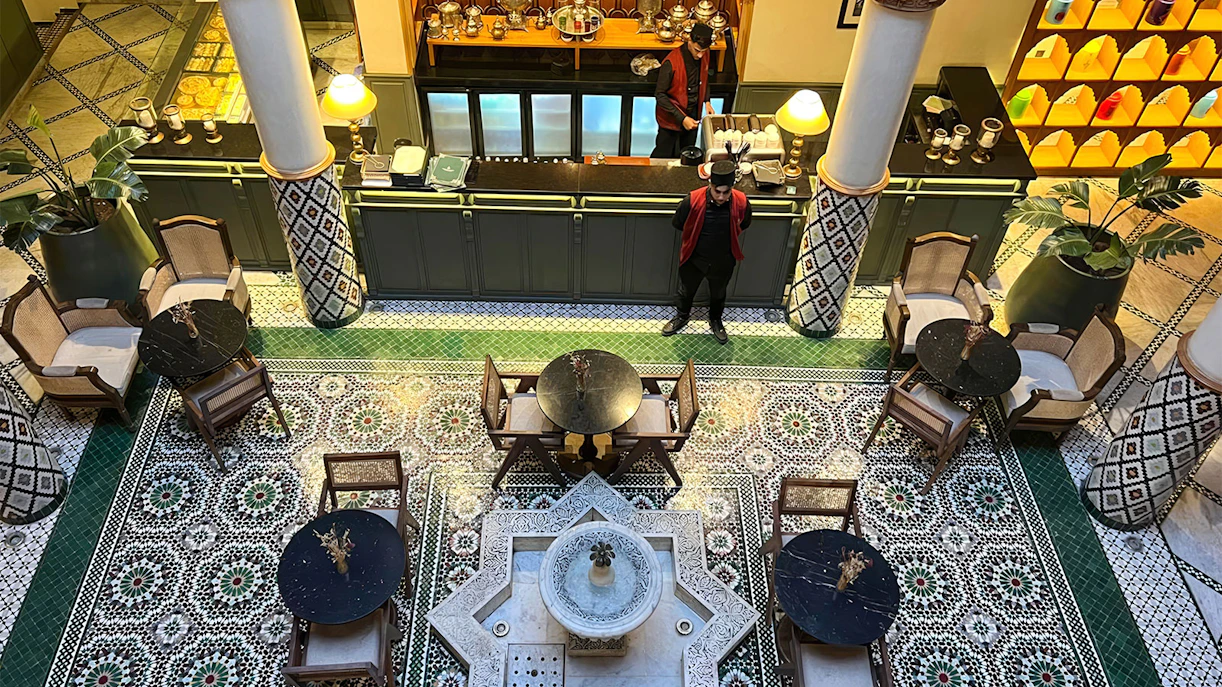 Moroccan Culinary Arts Museum interior with mosaic tiles and traditional seating.