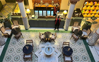 Moroccan Culinary Arts Museum interior with mosaic tiles and traditional seating.