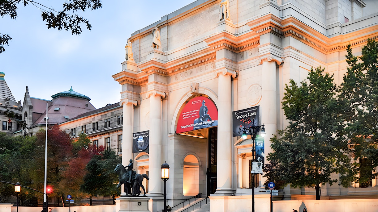 American Museum of Natural History facade illuminated at night, New York City.