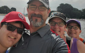 Group enjoying Washington National Mall with Washington Monument in background.