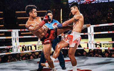 Muay Thai fighters in action at Rajadamnern Stadium, Bangkok.
