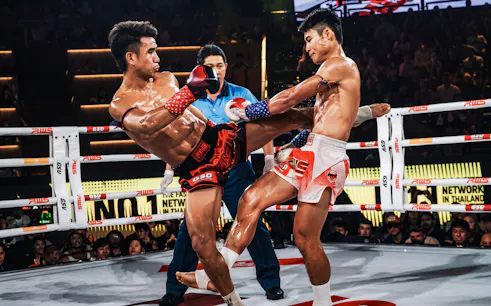 Muay Thai fighters in action at Rajadamnern Stadium, Bangkok.