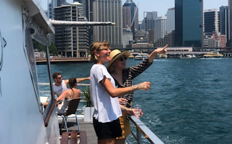 Guests enjoying views on a Sydney Harbour luxury dinner cruise.