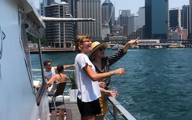 Guests enjoying views on a Sydney Harbour luxury dinner cruise.