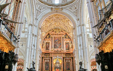 Cordoba Mosque-Cathedral interior with ornate arches and detailed ceiling.