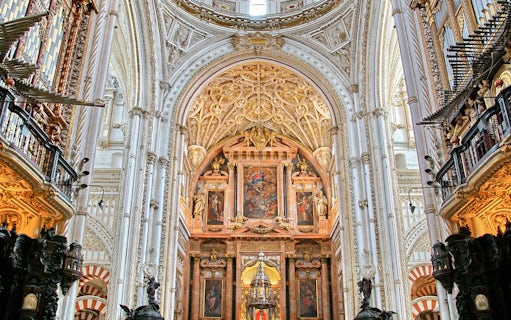 Cordoba Mosque-Cathedral interior with ornate arches and detailed ceiling.