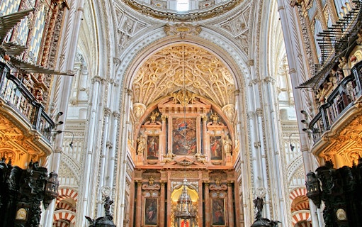 Cordoba Mosque-Cathedral interior with ornate arches and detailed ceiling.