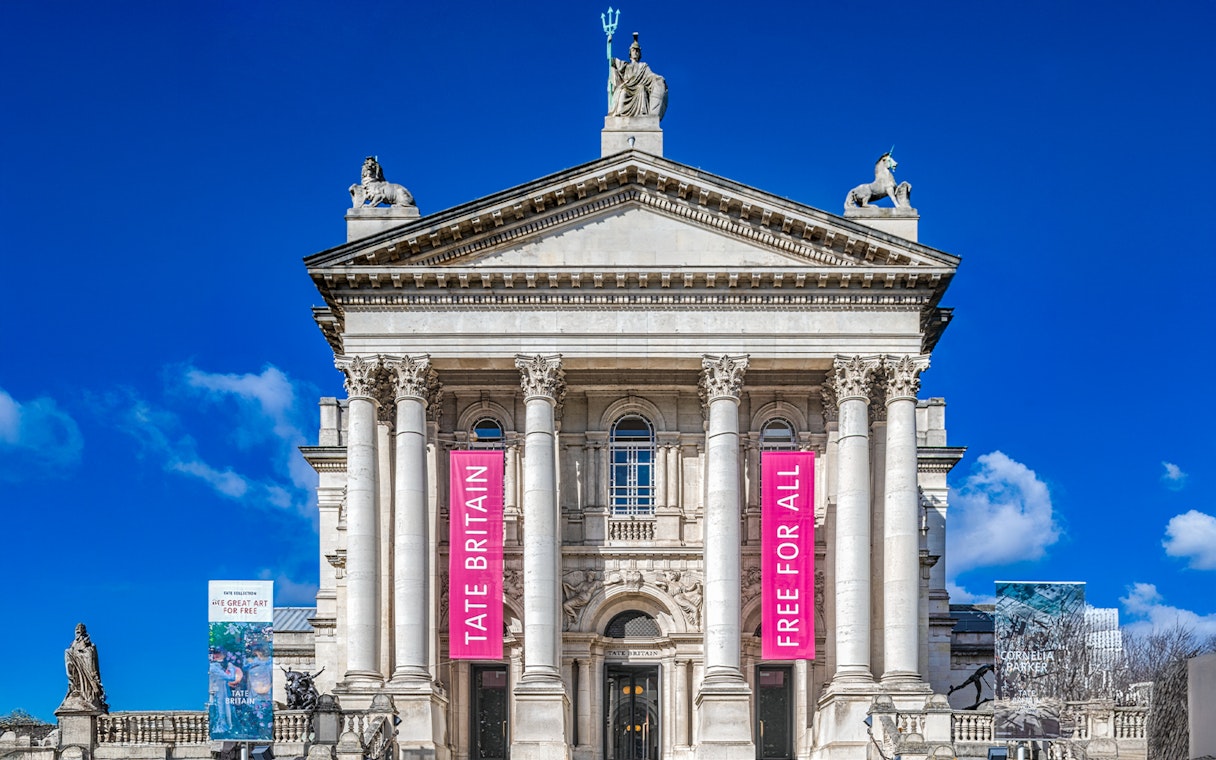 Tate Britain entrance with banners for Edward Burra and Ithell Colquhoun exhibition, London.