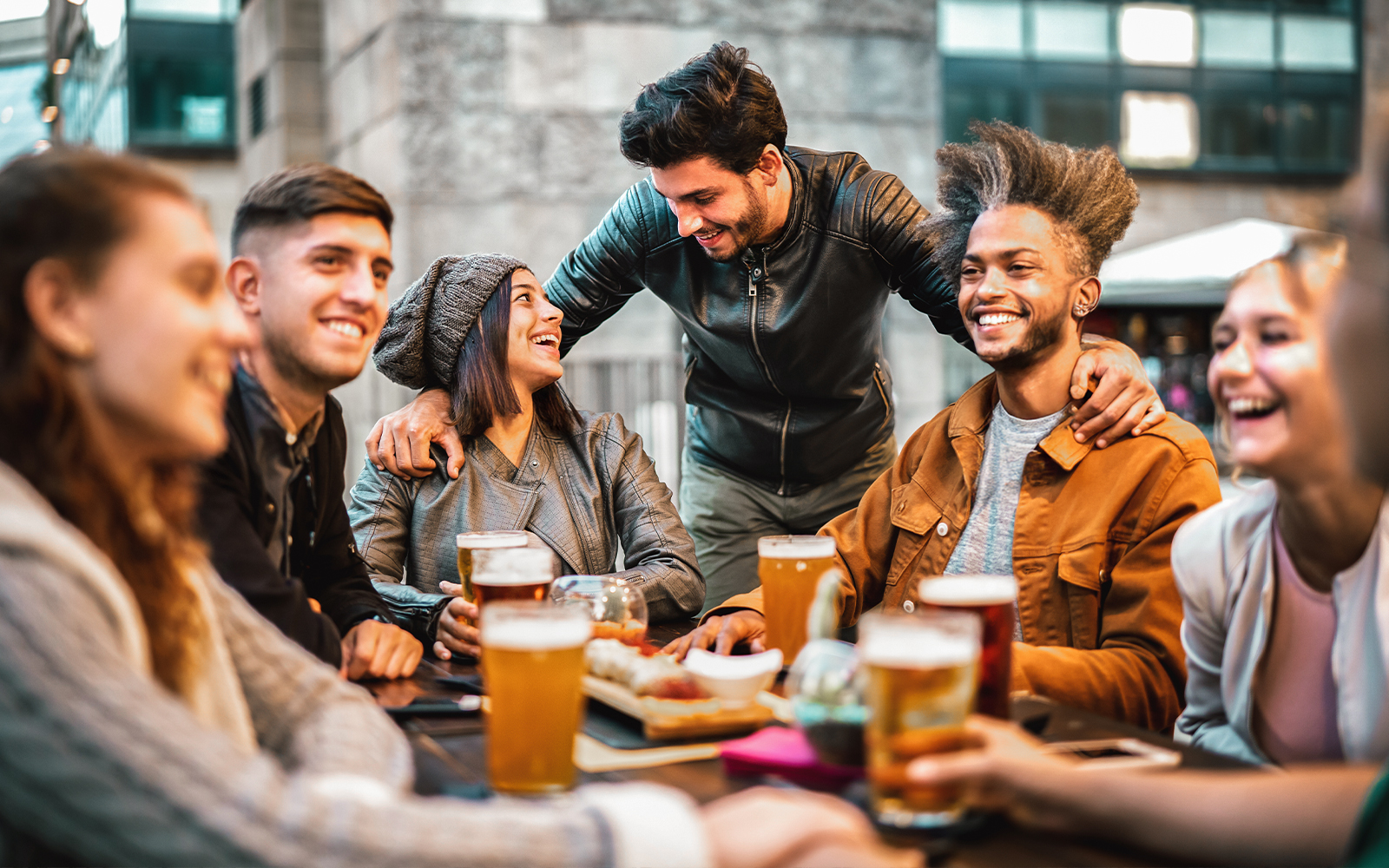 Friends on a beer tour in Prague, sampling local brews at a brewery.