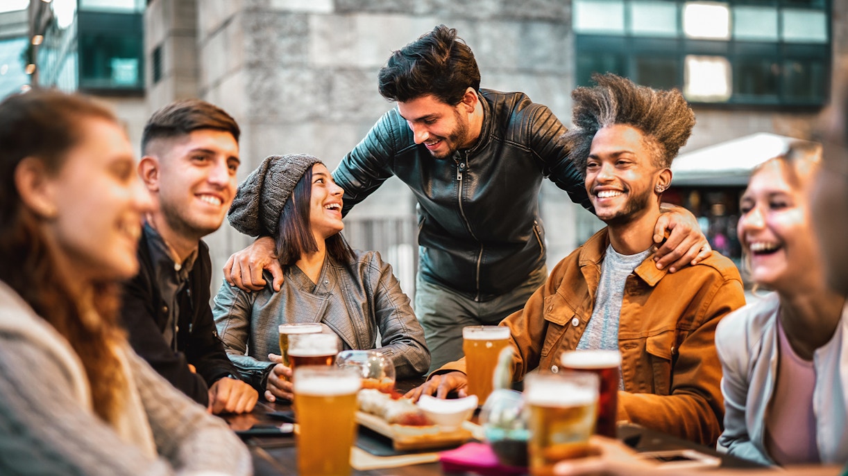 Friends on a beer tour in Prague, sampling local brews at a brewery.