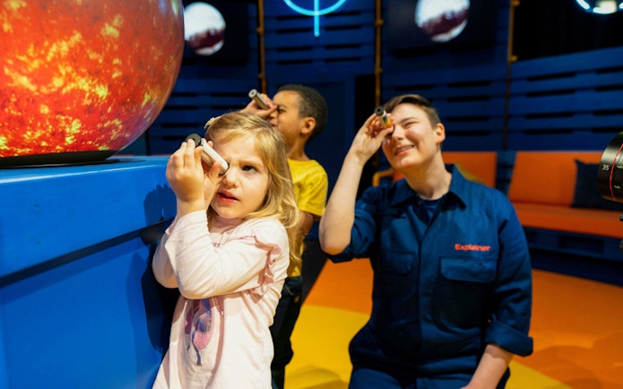Guests using telescopes at Astronomers Take Over, National Maritime Museum.