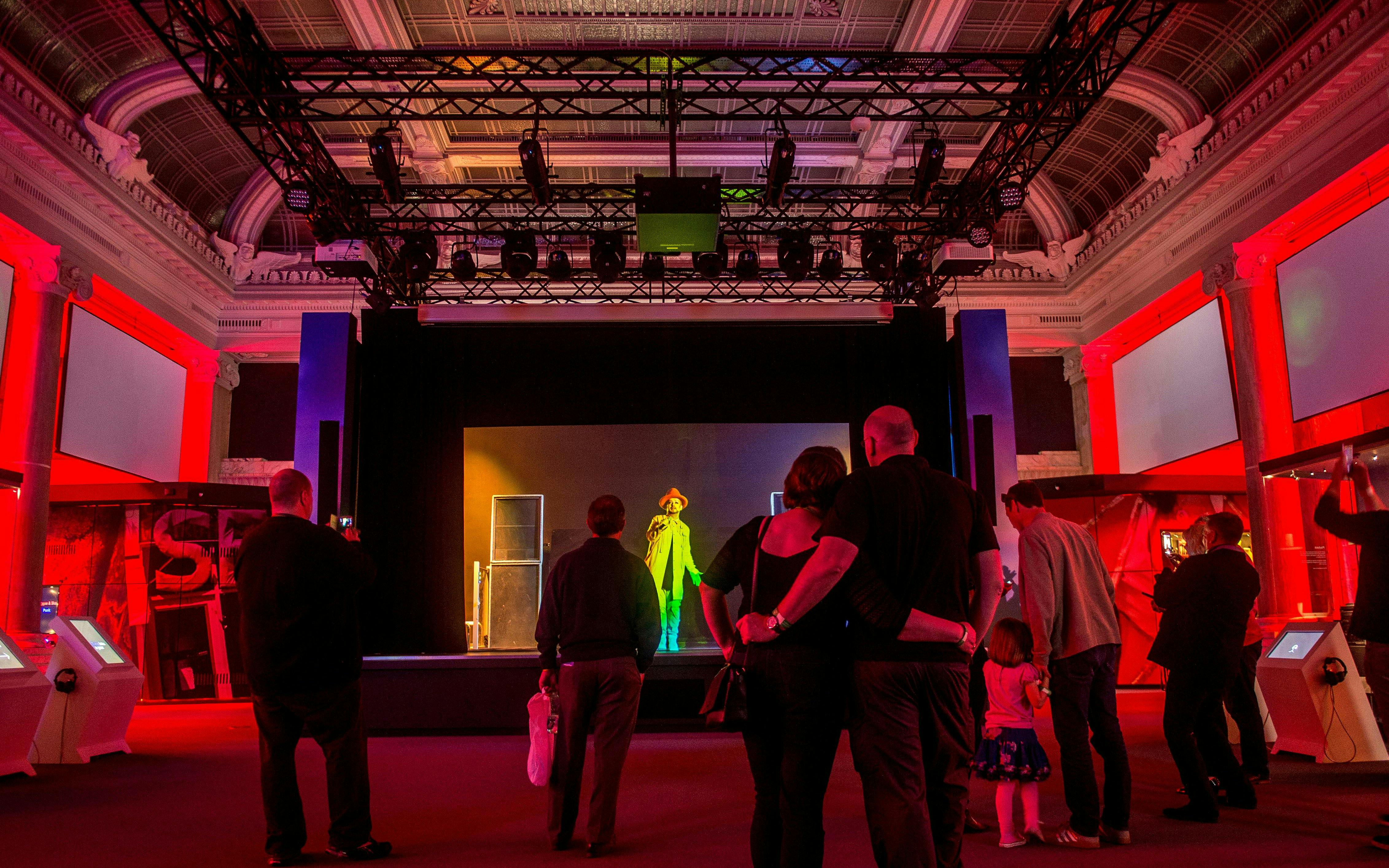 Visitors watching a music performance at The British Music Experience in London.