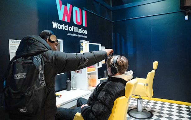 Guests experiencing audio illusions at World of Illusion, Dublin.