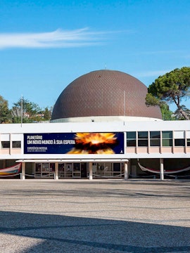 Navy Planetarium entrance with dome and promotional banner.