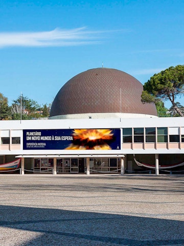 Navy Planetarium entrance with dome and promotional banner.