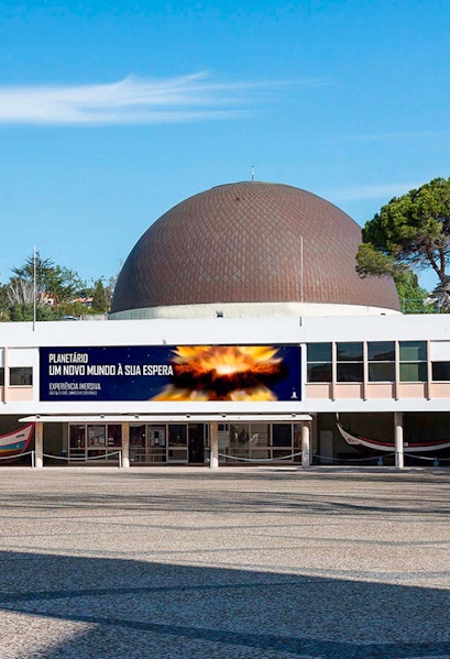 Navy Planetarium entrance with dome and promotional banner.