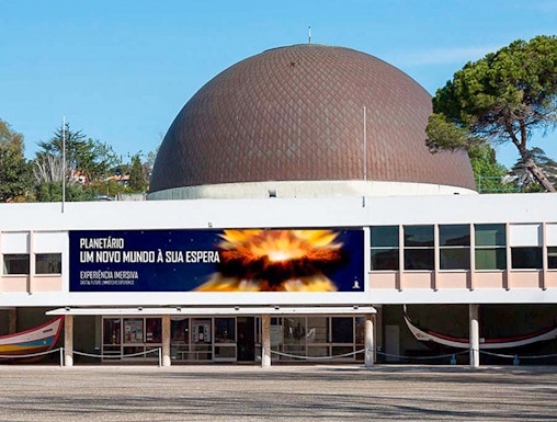 Navy Planetarium entrance with dome and promotional banner.