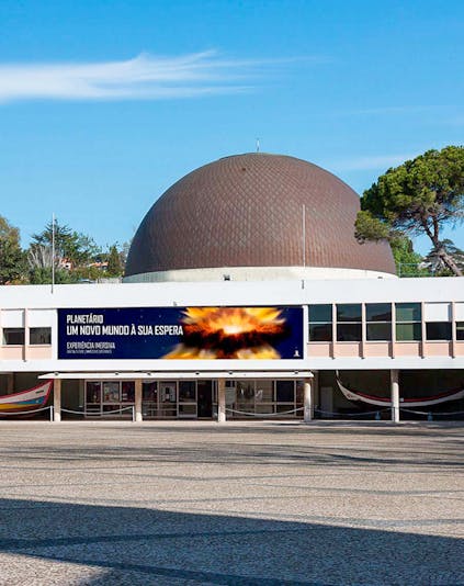 Lisbon Navy Planetarium exterior with visitors entering the building.