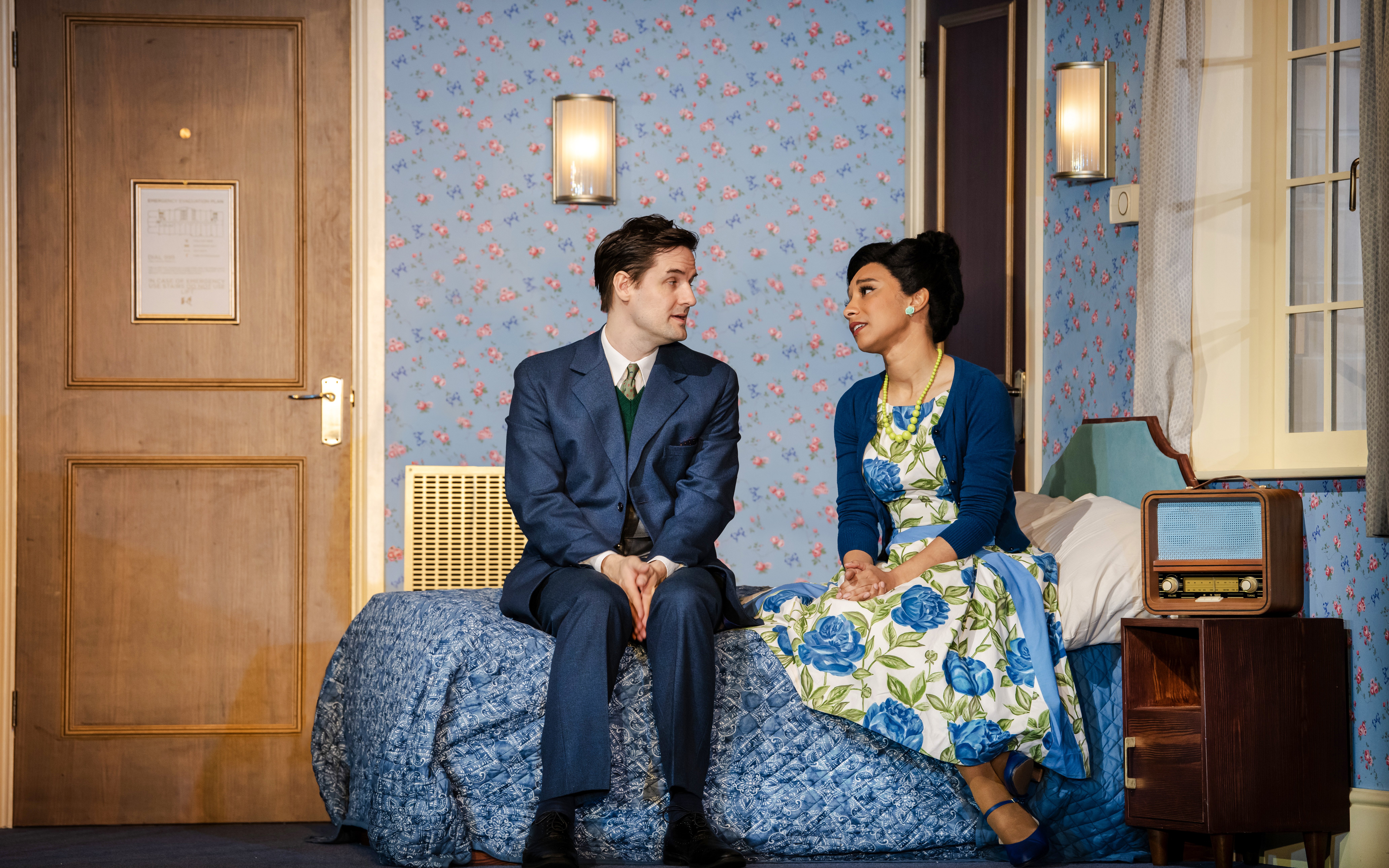 Actors in a vintage room scene from "The Comedy About Spies" production.