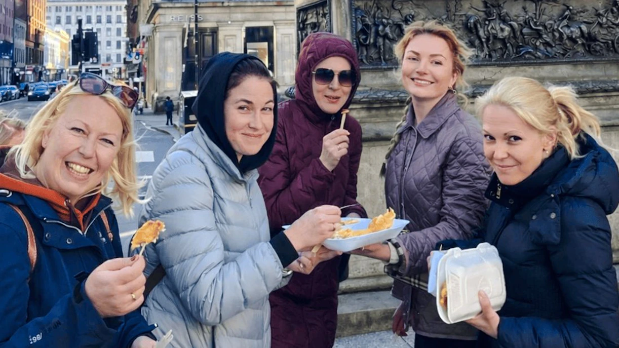 Guests enjoying local cuisine on a Glasgow food tour.