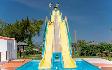Visitors enjoying the Kamikaze slide at Aqualand Algarve.