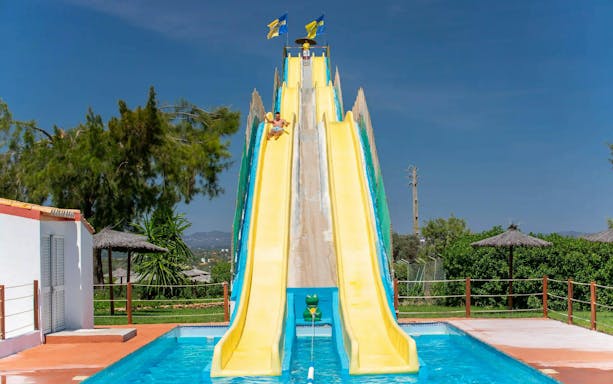 Visitors enjoying the Kamikaze slide at Aqualand Algarve.