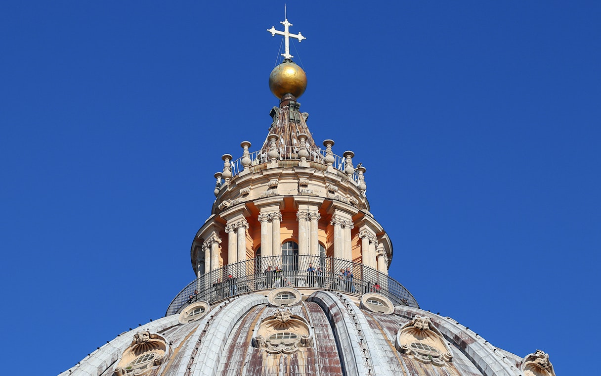 Upper dome of St. Peter's Basilica with cross and balustrade, Vatican City.