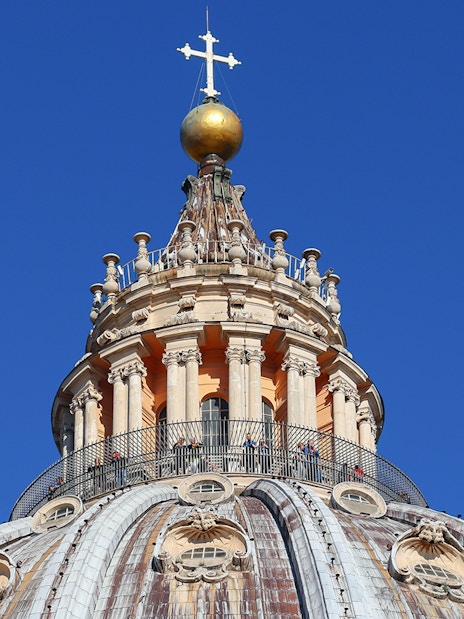 Upper dome of St. Peter's Basilica with cross and balustrade, Vatican City.