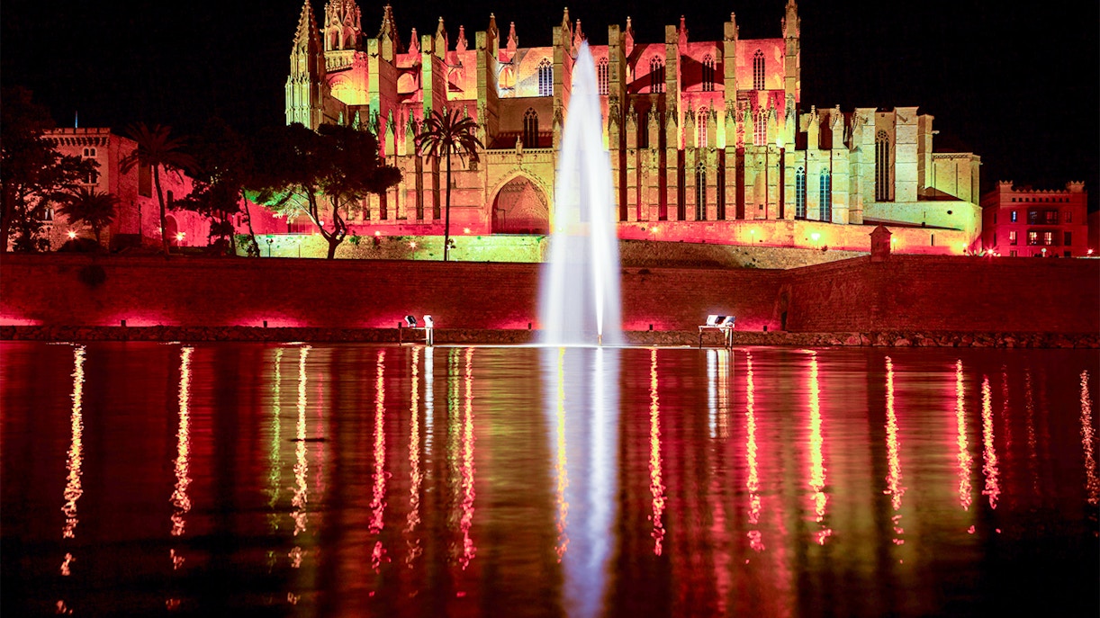 Gothic arches and stained glass windows inside Palma Cathedral, Mallorca.