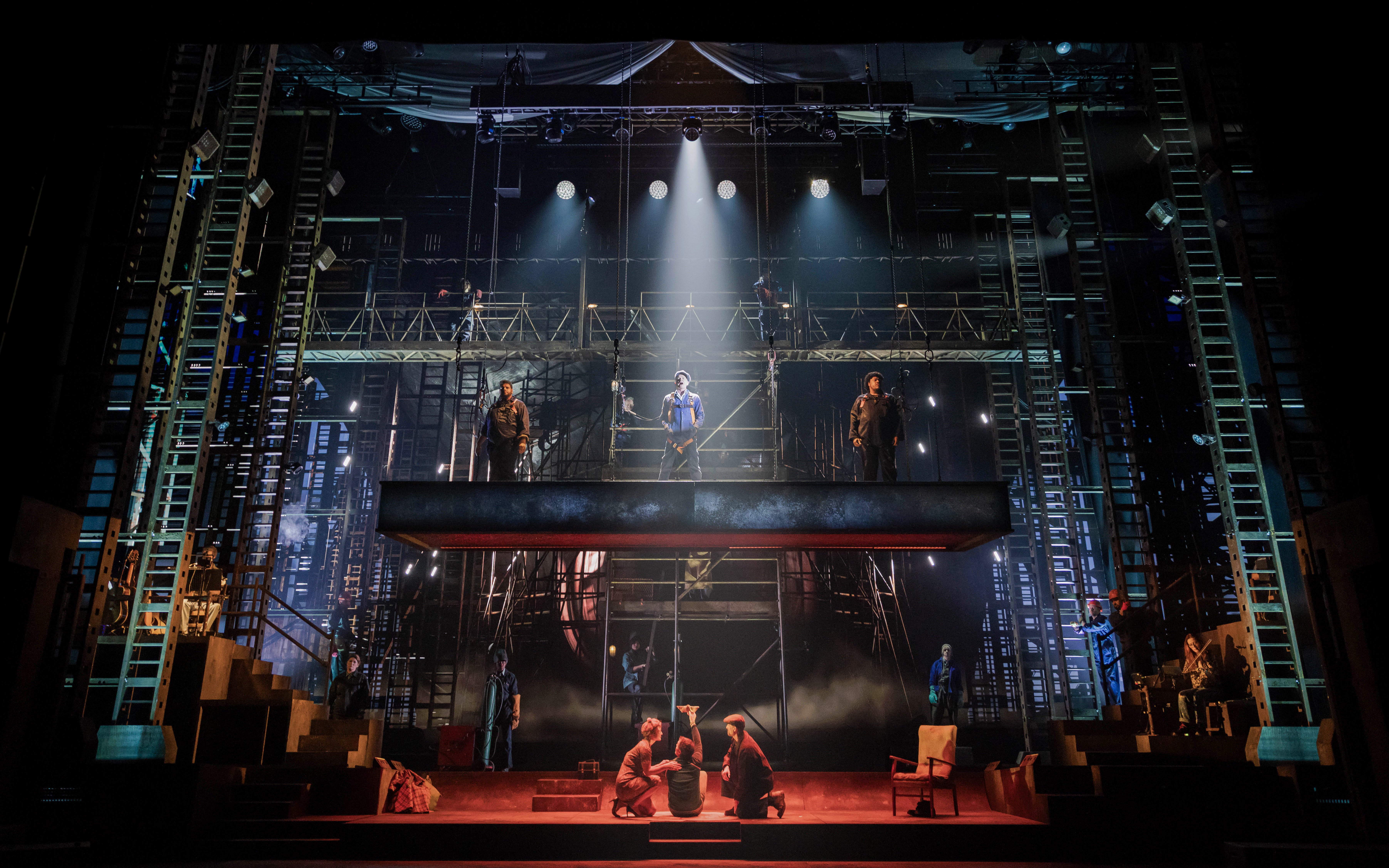 Stage performance of "The Last Ship" in Brisbane with actors on an industrial set.