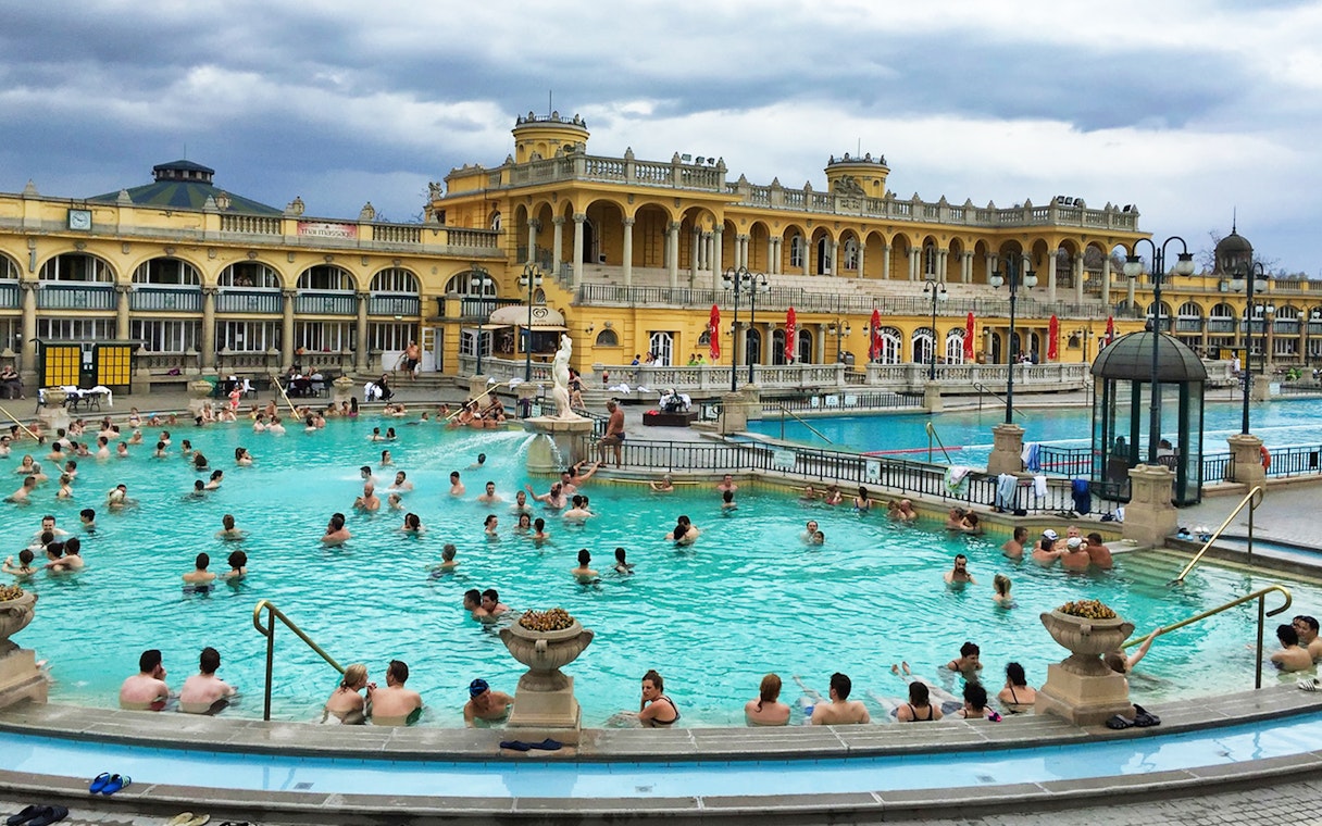 Tourists enjoying a relaxing day at the premium day spa in Szechenyi Bath, Budapest, with full-day access tickets and private cabin