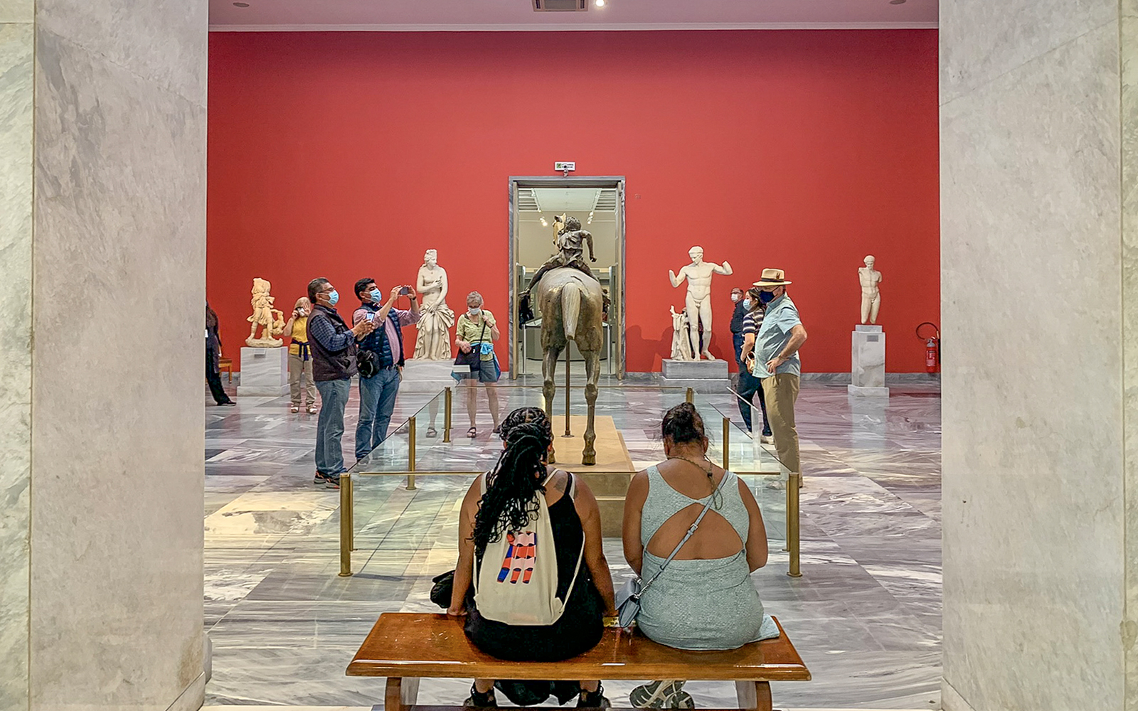 Visitors viewing sculptures at the National Archaeological Museum.