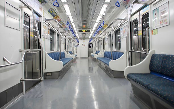 Interior of a KORAIL train with empty blue seats, South Korea.